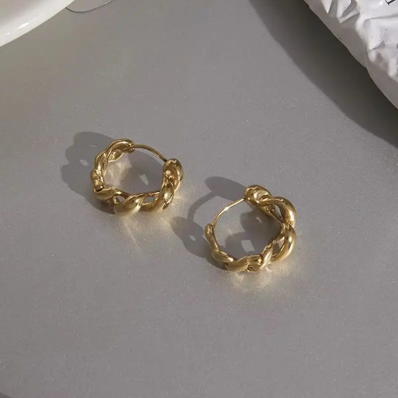 Kika Classic Glossy Hollow Out Wrapped Wave Earrings