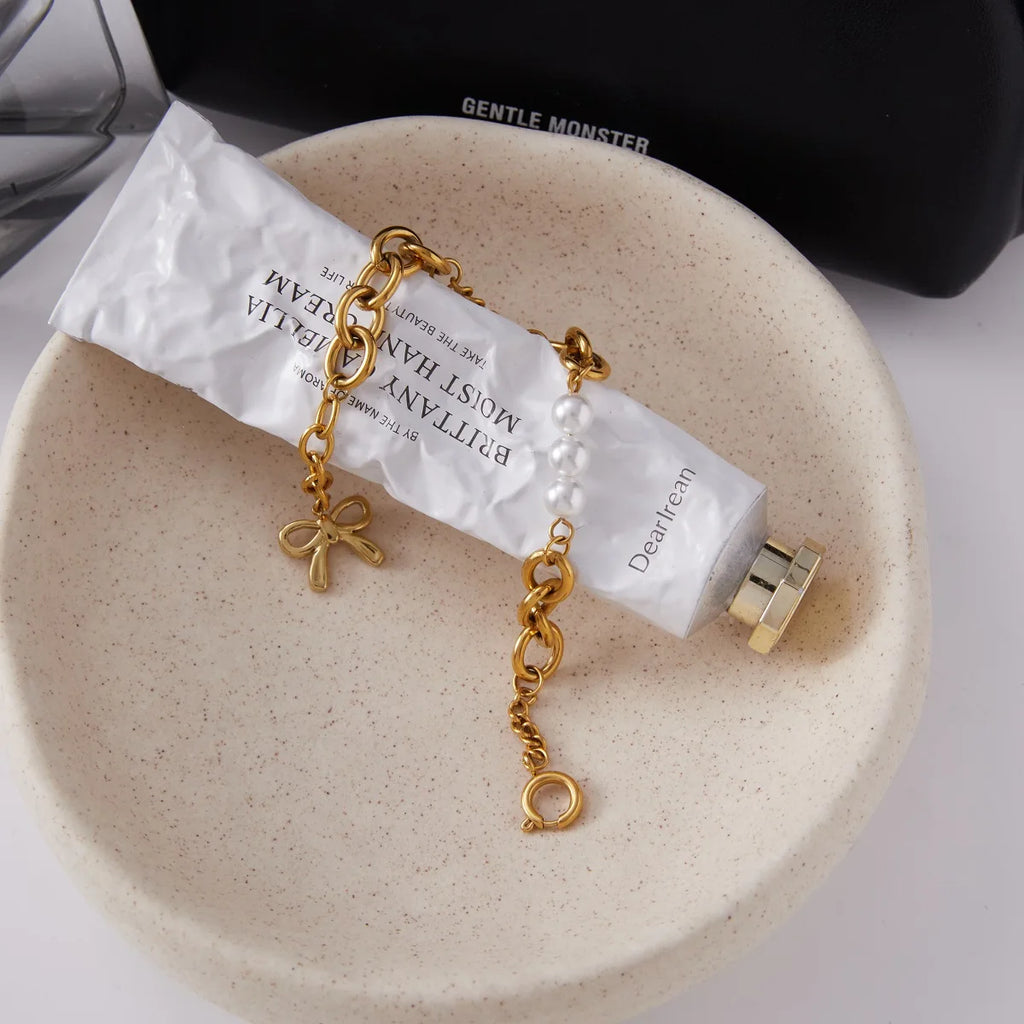 Kika Minimalist Classic 18K Gold Color Plated Bowknot Pendant Glass Pearl Bracelet Waterproof Stainless Steel
